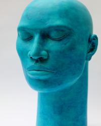 Large ceramic head with a semi matt deep turquoise glaze, height 48cm