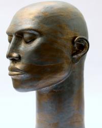 ceramic head with brown and gold glaze
