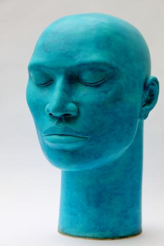 Large ceramic head with a semi matt deep turquoise glaze, height 48cm