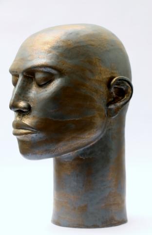 ceramic head with brown and gold glaze
