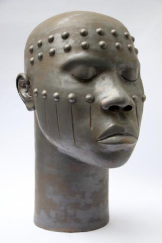 Large ceramic head inspired by African body scarification