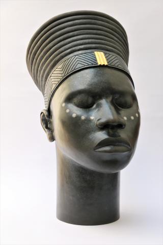 Raku fired female ceramic African head, with gold leaf detail