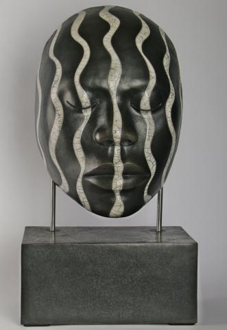 Raku fired  male African face, mounted on ceramic base