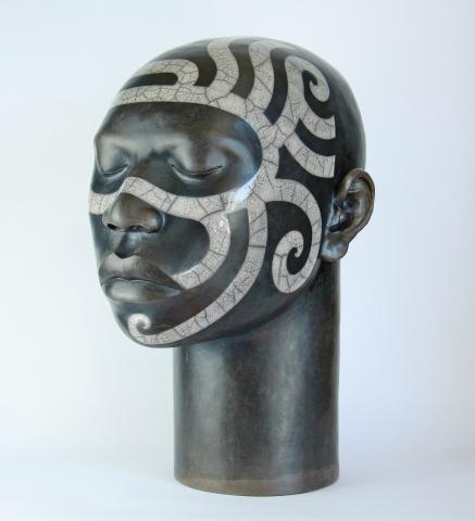 Raku fired ceramic head with tribal design, height 46cm